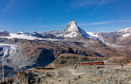 Red train to Gornergrat over Matterhorn peak in Switzerland.