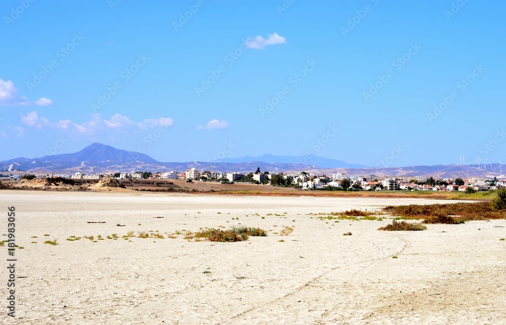 Outdoor landscape of Stavrovouni mountain with salt lake and cloudy blue sky