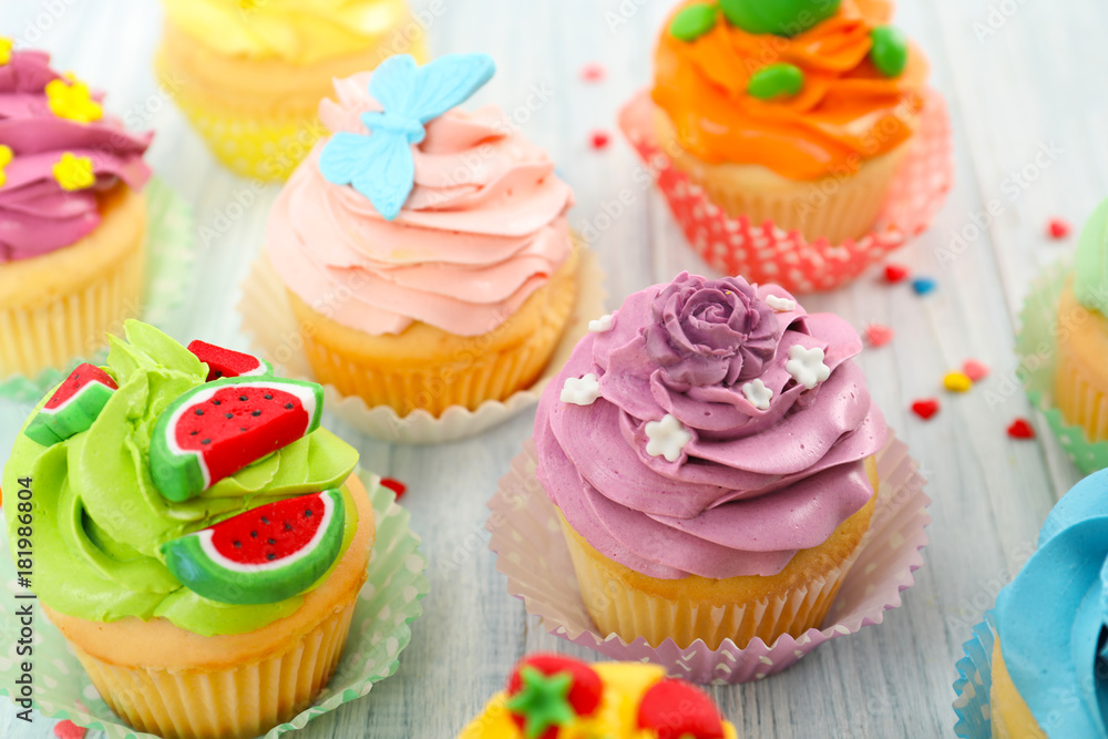 Beautiful cupcakes on wooden table Beautiful cupcakes on wooden table