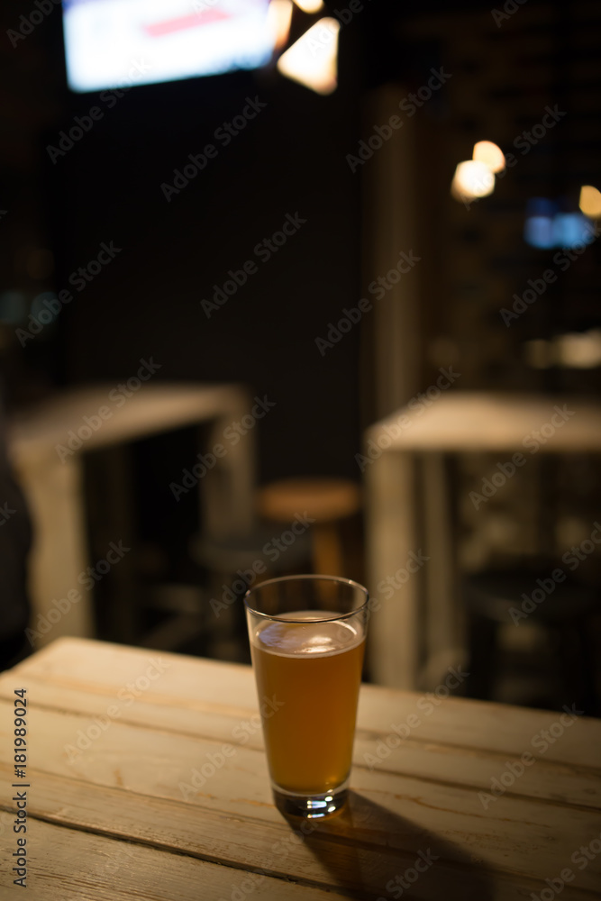 Craft beer on wood table in a pub