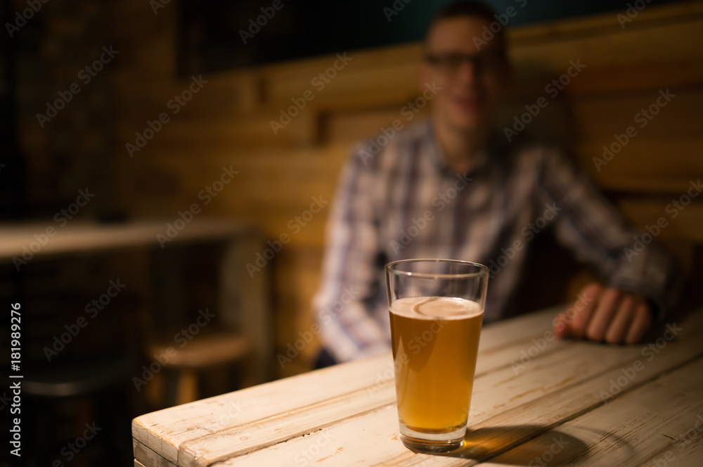 Man in a pub in front of craft beer