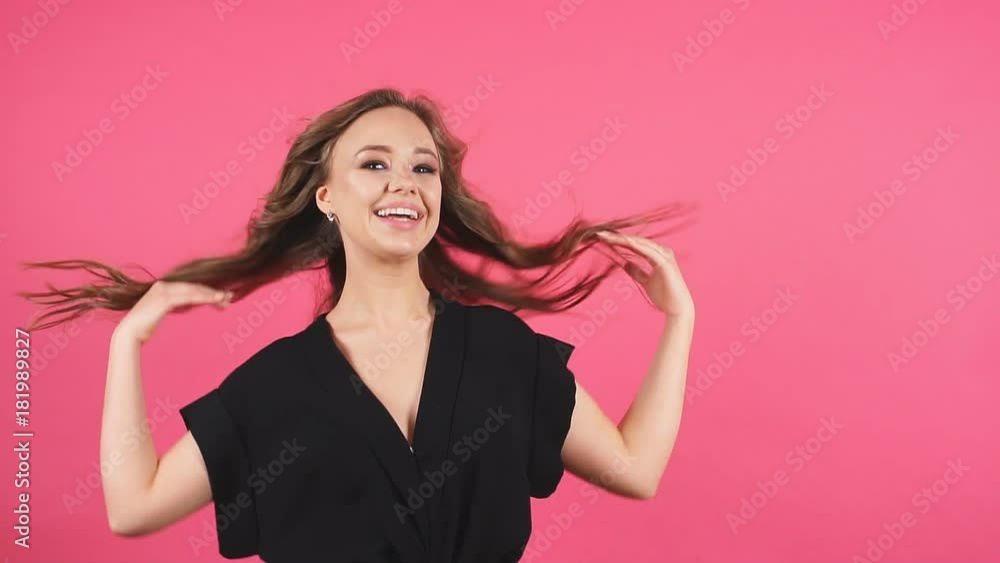Portrait of young attractive girl smiling looking at camera. Slow motion. Portrait of young attractive girl smiling looking at camera. Slow motion.