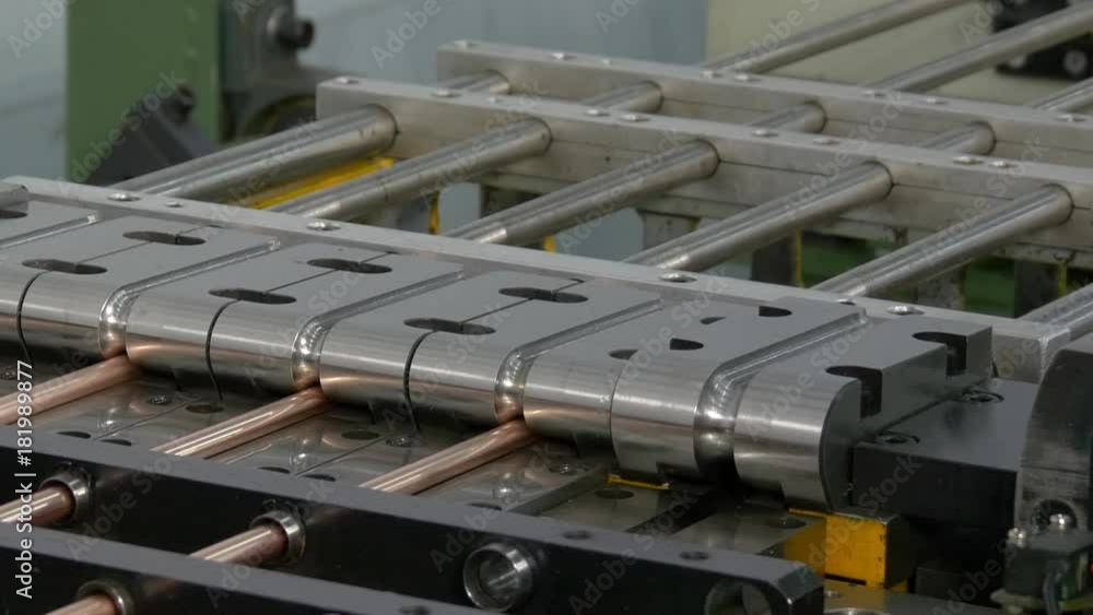 Bending and cutting metal copper pipes tubes on industrial CNC machine. Automation of work. Refrigeration and ventilation equipment and air conditioners. Modern technologies. Bending and cutting metal copper pipes tubes on industrial CNC machine. Automation of work. Refrigeration and ventilation equipment and air conditioners. Modern technologies.