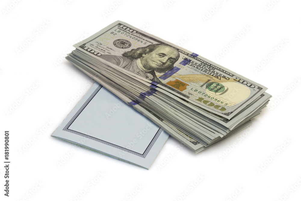 One hundred dollars banknotes lie on checkbook isolated on white background One hundred dollars banknotes lie on checkbook isolated on white background