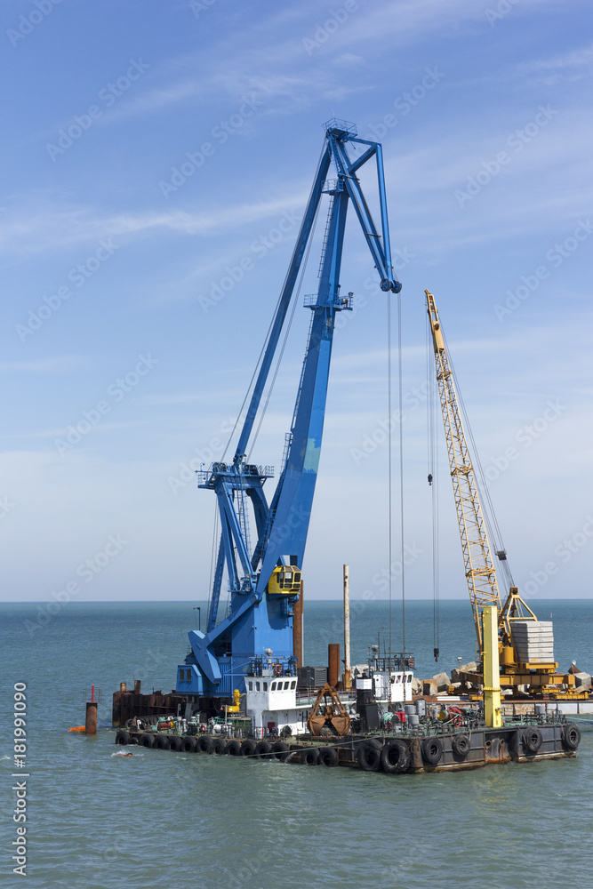 crane barge doing marine heavy lift installation works in the gulf or the sea