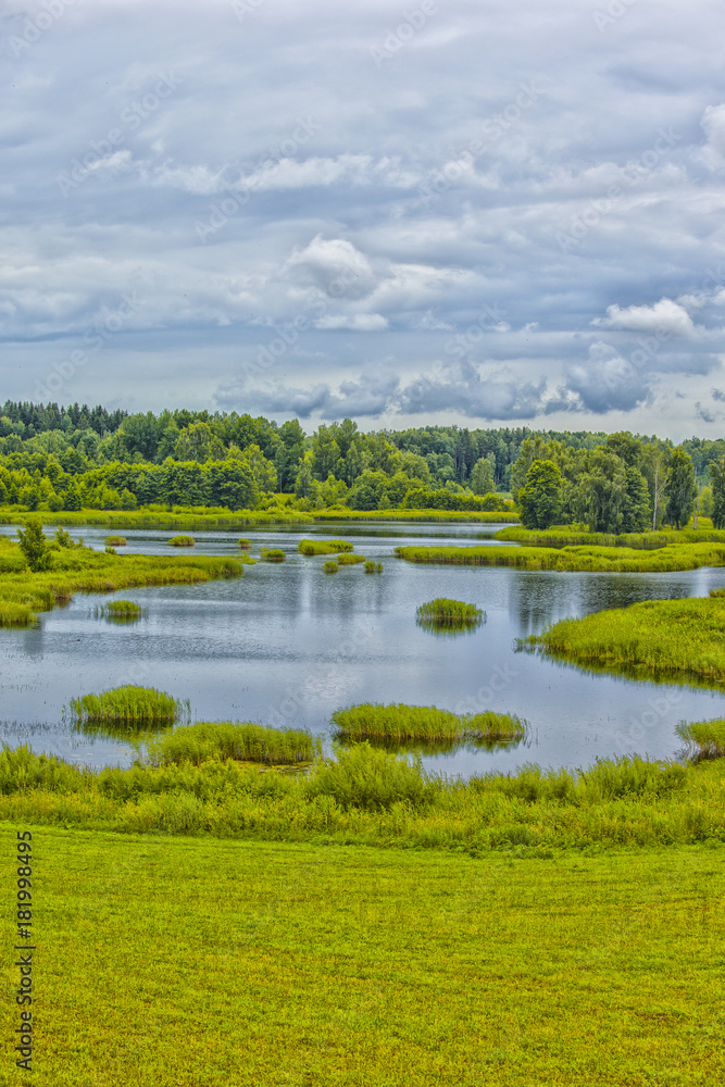 Travel Concepts and Ideas. Belarussian National Park Braslav Lakes Surrounded by Densely Forested Area at Noon During Summertime.