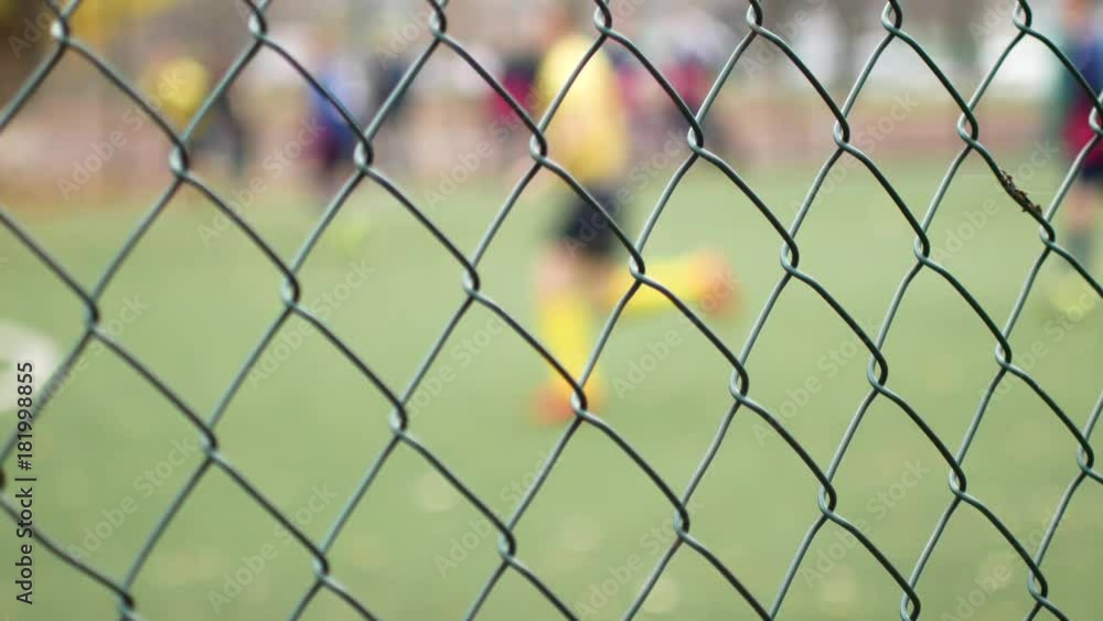 Football is behind the metal fence. Correctional institution Football is behind the metal fence. Correctional institution