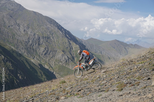 Enduro journey with dirt bike high in the mountains