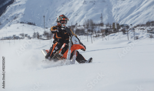 Enduro Snowbike Snowmobile journey with dirt bike high in the mountains