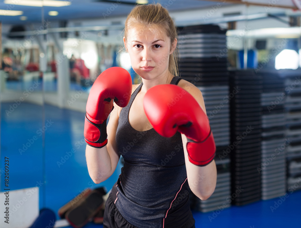 Portrait of  woman who is training in box gym.