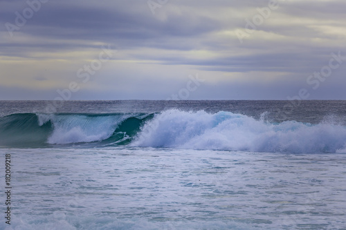 Breaking ocean wave - minimalist landscape  nothing but ocean and sky with copy space