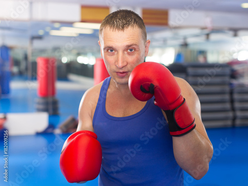 Portrait of active male who is boxing © JackF
