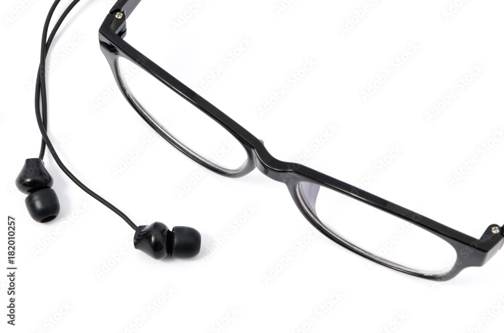 Black earphones and eyeglasses Black earphones and eyeglasses