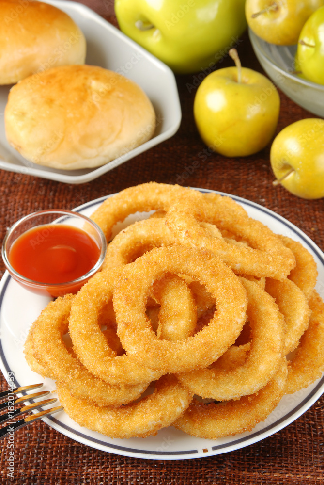 Golden onion rings and ketchup       