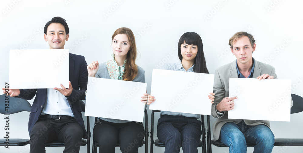 Group of people showing white boards. Group of people showing white boards.