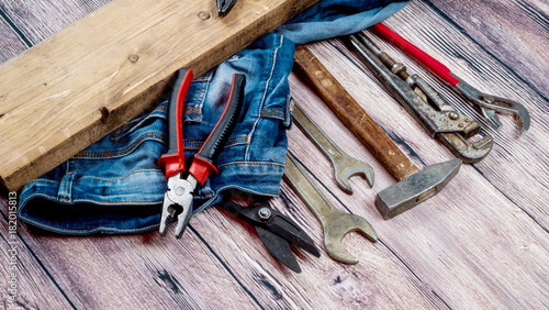 A set of tools for repair on a wooden background photo