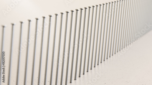 Endless line of iron nails on a modern surface