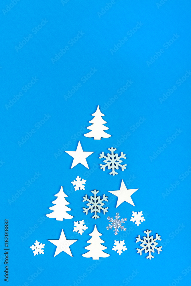 Creative Christmas tree. christmas tree made from christmas decorations on blue background with empty copy space for text Creative Christmas tree. christmas tree made from christmas decorations on blue background with empty copy space for text