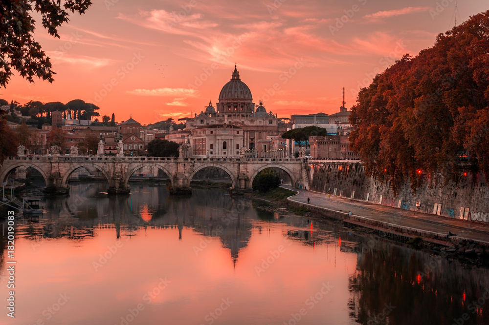 Beautiful view over St Peter's basilica and Vatican from the bridge Umberto I in Rome, Italy on a sunset