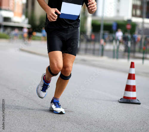 isolated runner with bandages at knees