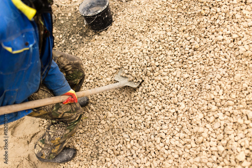 worker with a shovel at the construction site