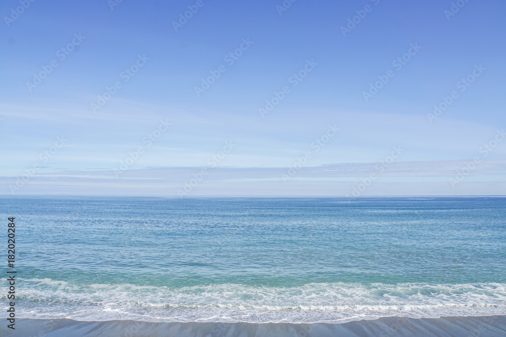 clear blue sea with small waves in blue sky