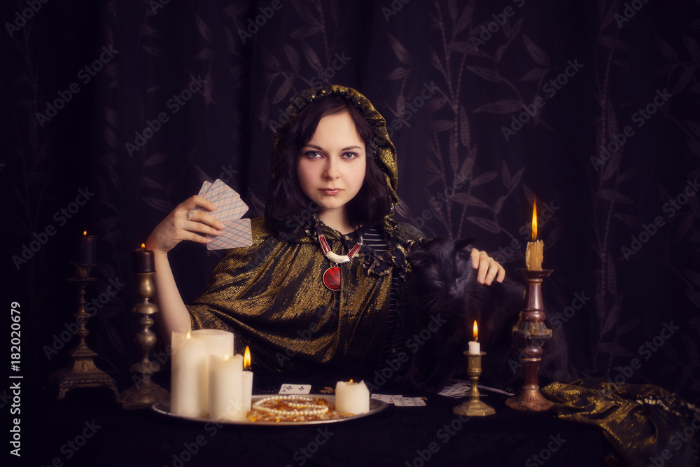Young woman with divination cards in room Young woman with divination cards in room