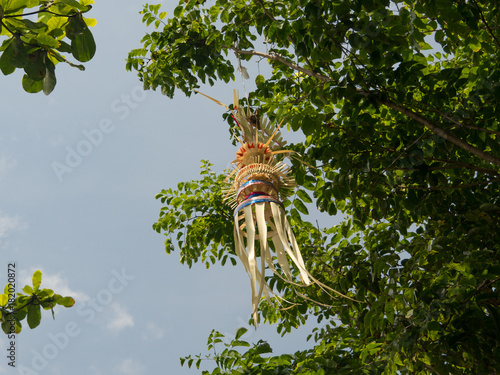 Traditional balinese penjor in Uluwatu temple of Bali, Indonesia. Decoration are set on Bali in honour of hindu gods. November, 2017 photo