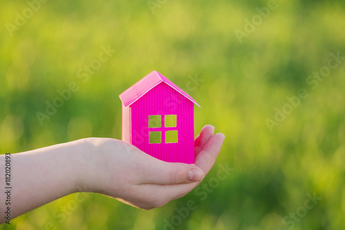 paper house in hand outdoor