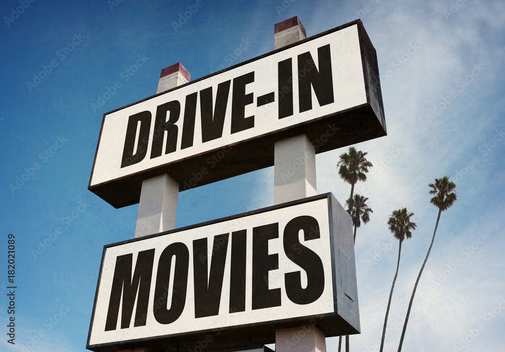 aged and worn drive in movies sign