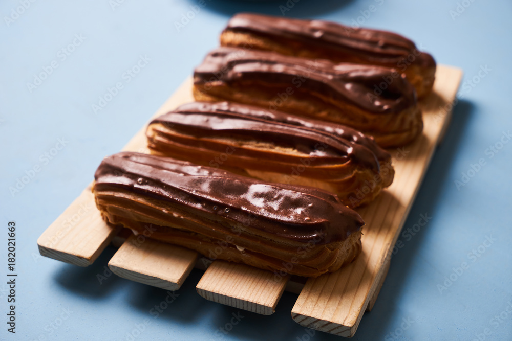 Delicious eclairs with chocolate frosting Delicious eclairs with chocolate frosting