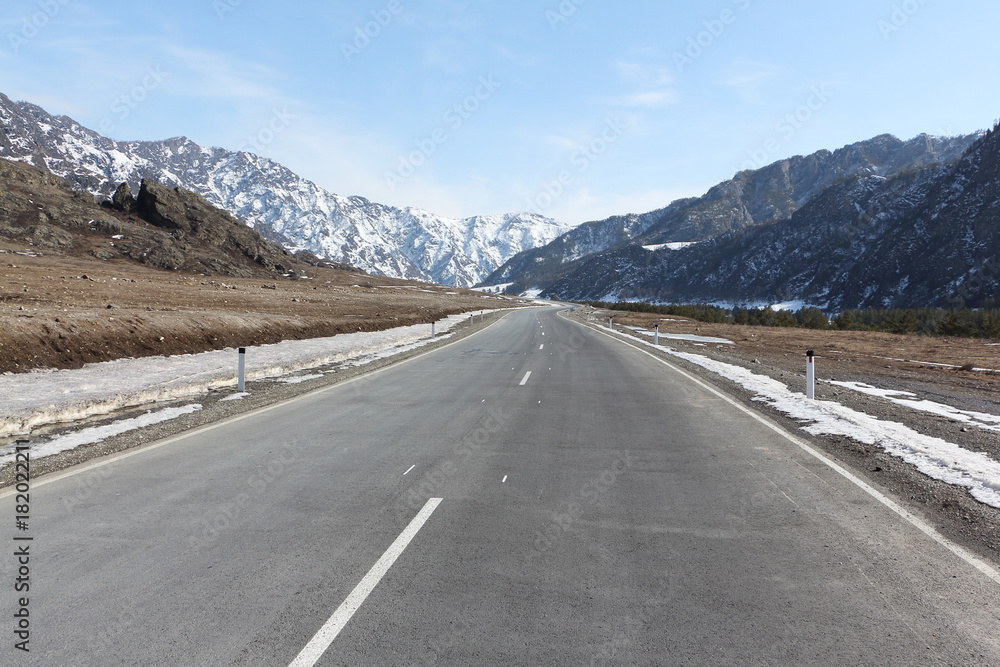 Road between the snowy Altai Mountains, Chemalsky Trakt, Russia Road between the snowy Altai Mountains, Chemalsky Trakt, Russia