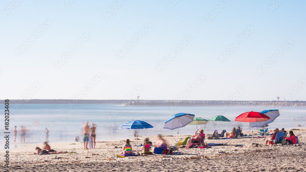 long exposure beach scene umbrellas color europe california harbor oceanside north county