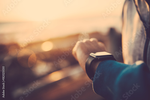  Close up of man using his smart watch outdoors photo