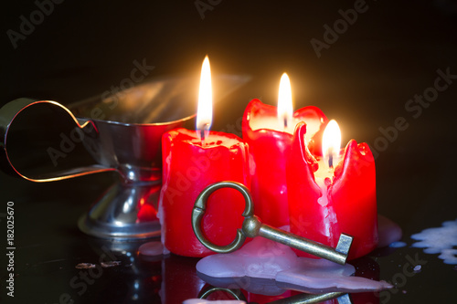 Divination and pouring wax with key and candle
 photo