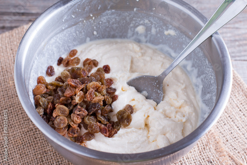 Ingredients for the preparation of cottage cheese -cottage cheese, eggs, sugar, raisins photo