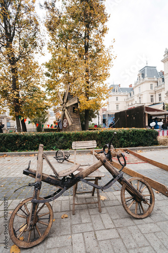Wooden bicycle stands on the street