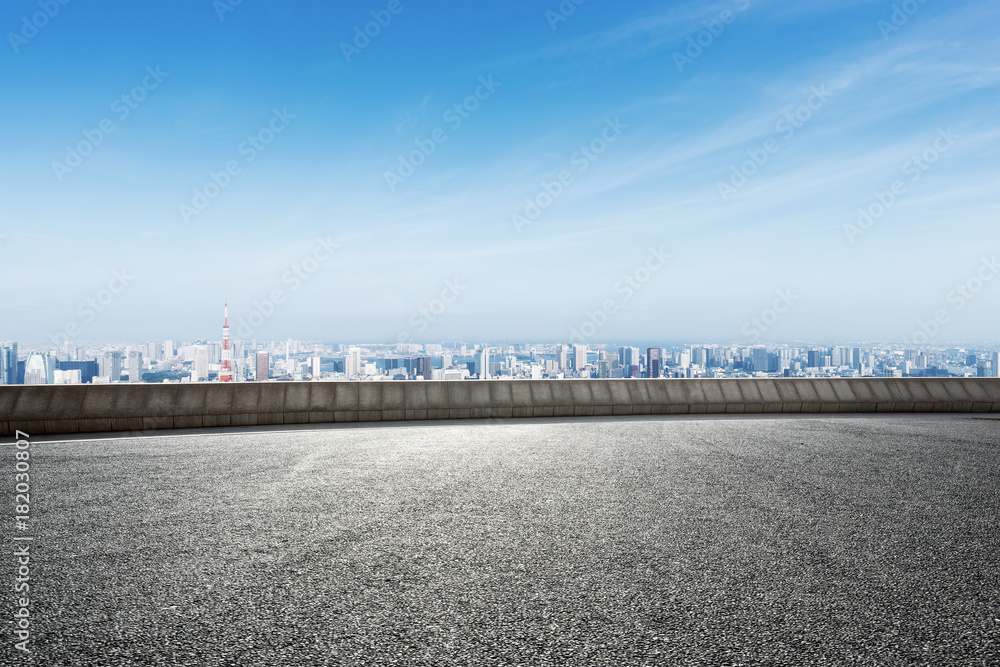 Fototapeta premium empty asphalt road with modern cityscape