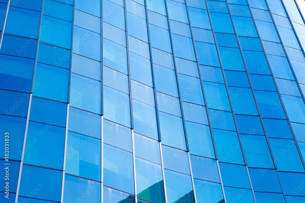 Modern architecture in blue tone,Windows on Skyscrapers,reflection on the glass