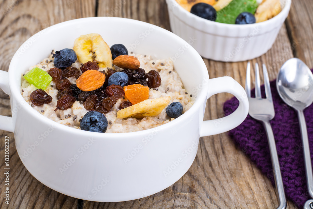 Oatmeal with fruit and nuts-hearty and tasty breakfast Oatmeal with fruit and nuts-hearty and tasty breakfast