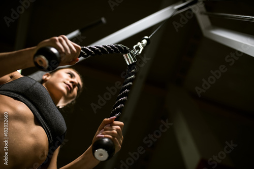 A girl trains in the gym.