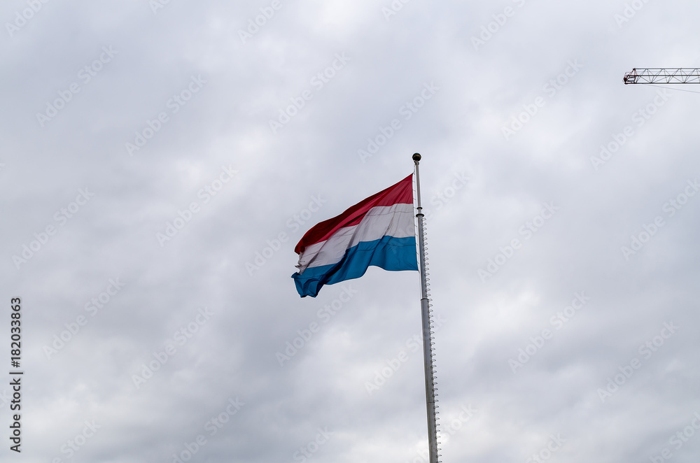 Low Angle View of Luxembourgian Flag against Sky on a Windy Day in Autumn in Luxembourg City, Luxembourg Low Angle View of Luxembourgian Flag against Sky on a Windy Day in Autumn in Luxembourg City, Luxembourg
