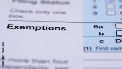 Tax form 1040. Dolly shot. Extrem close-up view.
