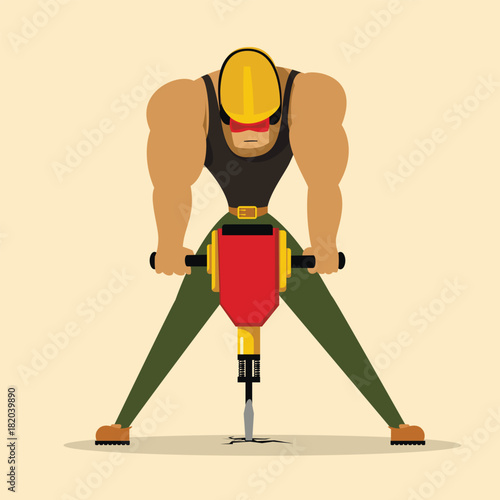 Worker drilling with jackhammer
