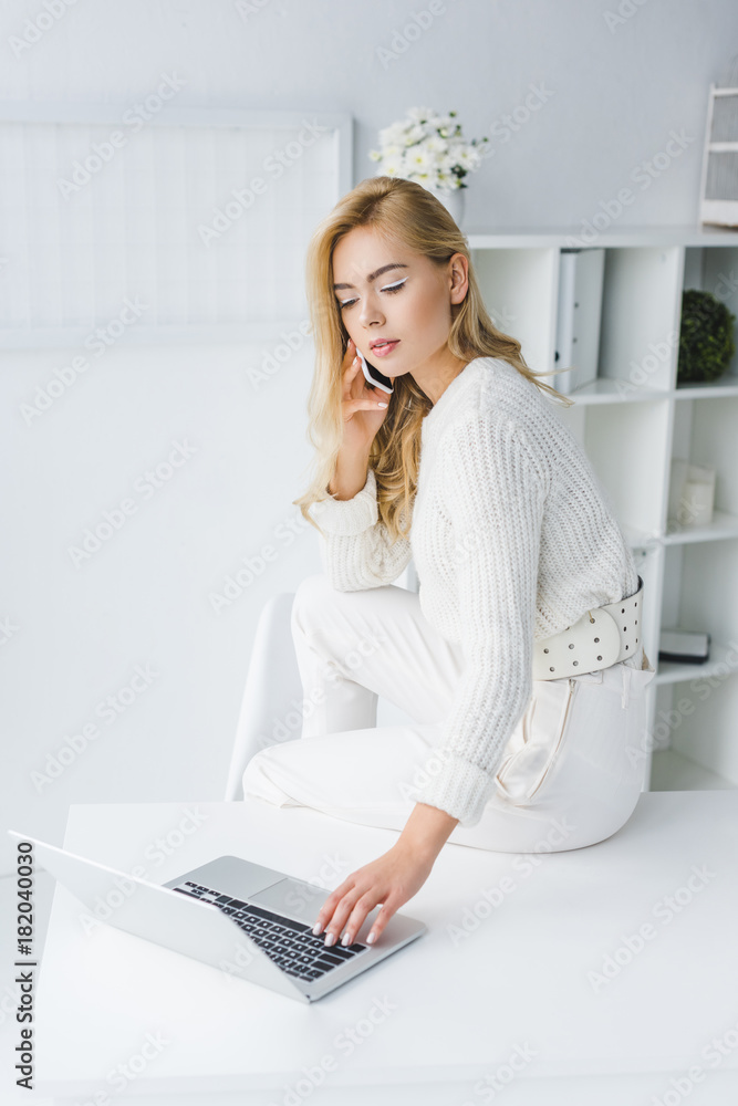 businesswoman with paperwork and laptop businesswoman with paperwork and laptop
