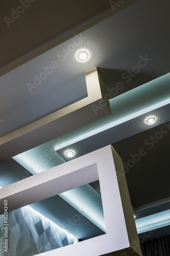 suspended ceiling and drywall construction in the decoration of the apartment or house. focus on the spot