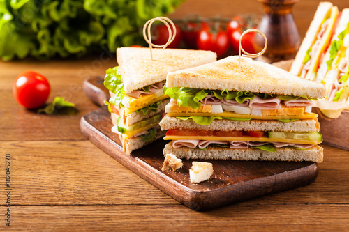 Delicious toast sandwich with ham, cheese, egg and vegetables.