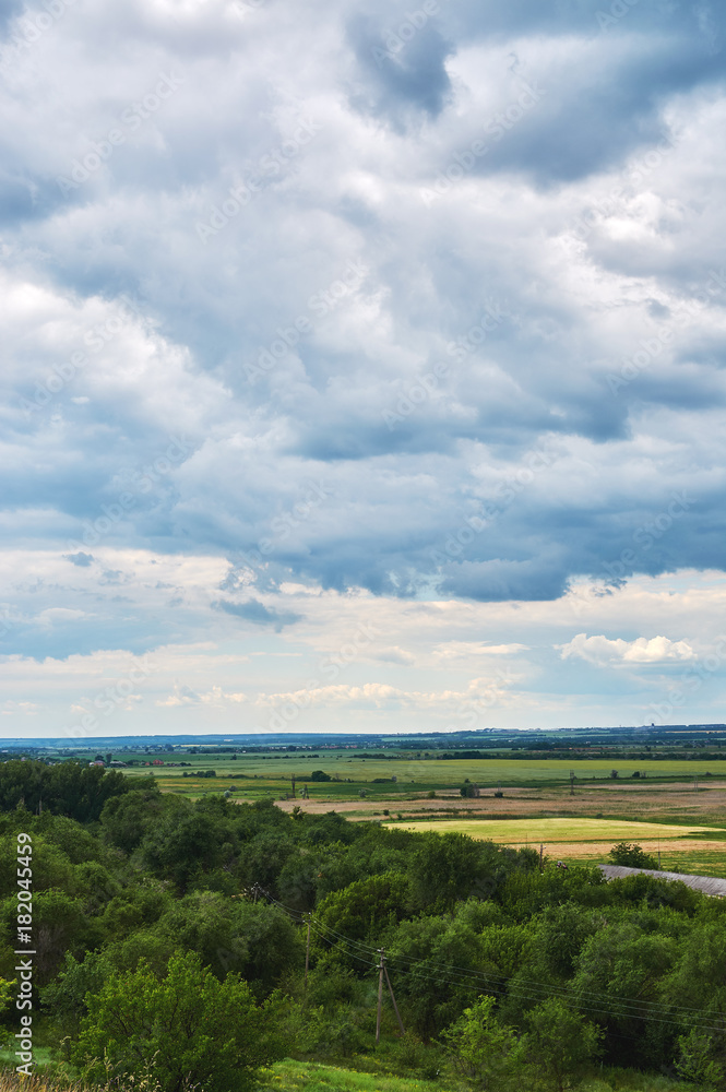View from the hill to the green valley in cloudy weather. View from the hill to the green valley in cloudy weather.