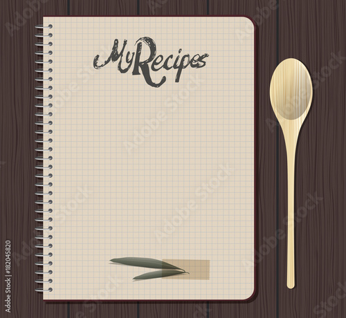 Recipe notebook graph with hand drawn text. Olive leaves. Spoon fork. Wooden background.