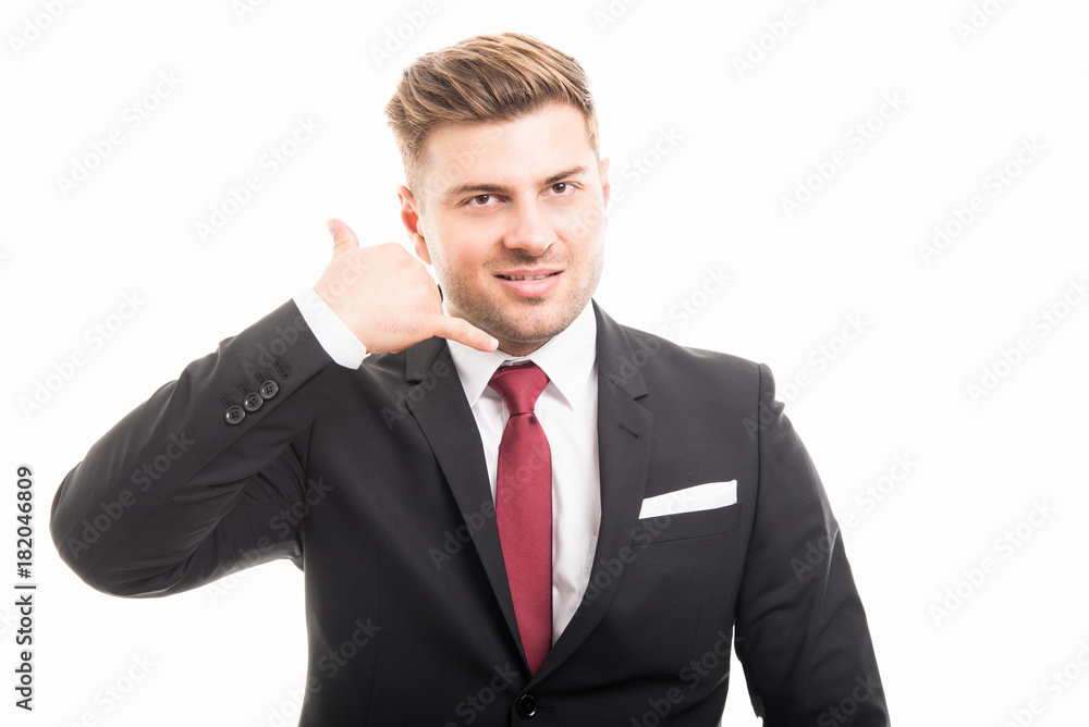 Handsome business man showing contact gesture Handsome business man showing contact gesture